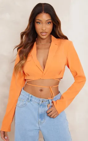 Chemise orange à liens noués autour de la taille